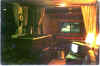 Interior of '80 Royal showing toiletry area created with full-length curtains